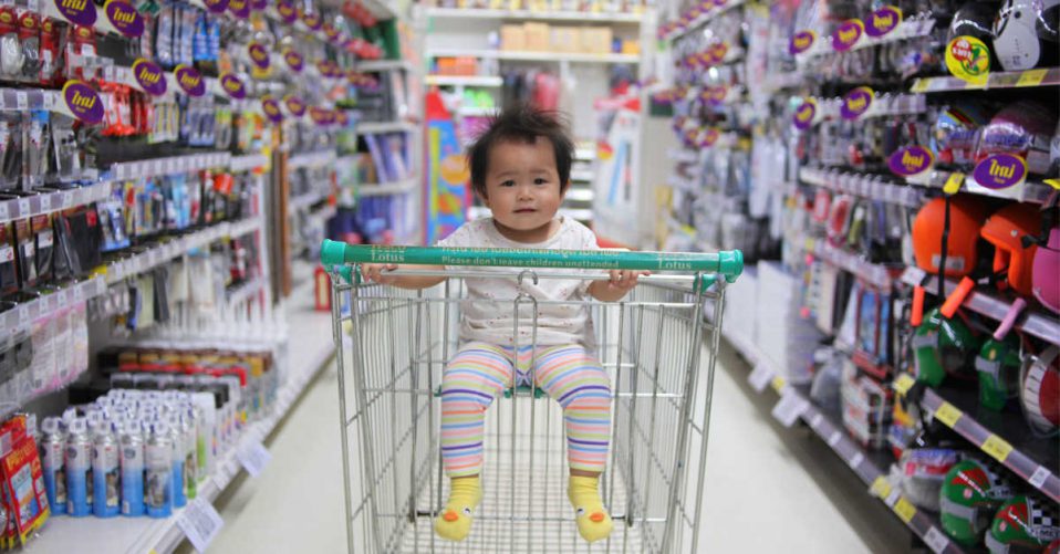 Child in shopping trolley