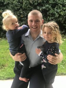 Haydn Lea holding his two daughters